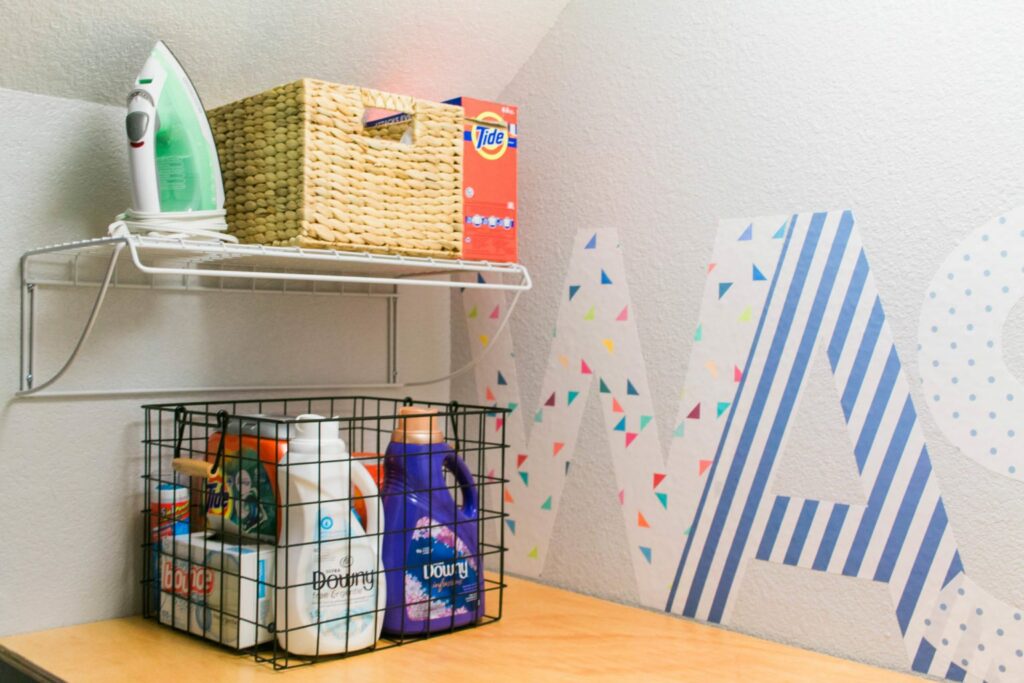 Our Tiny Laundry Room Reveal - You don't need to have a huge space to have a practical and beautiful laundry room! I love this closet laundry room! What a great use of a small space. Great idea for small laundry rooms! 