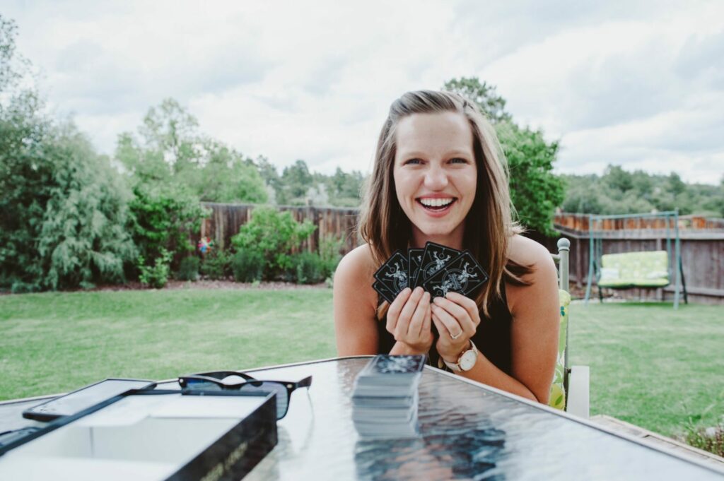 Elizabeth Mayberry of Oak + Oats playing Deer Lord! the party game! Plan a game night (or day) with your friends to build community!