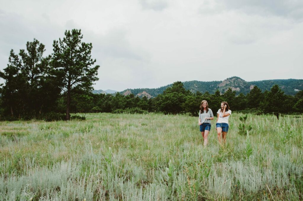 Elizabeth Mayberry Life Style Blogger at  Oak + Oats in Patagonia Shorts. Love the wildflowers and sunset.