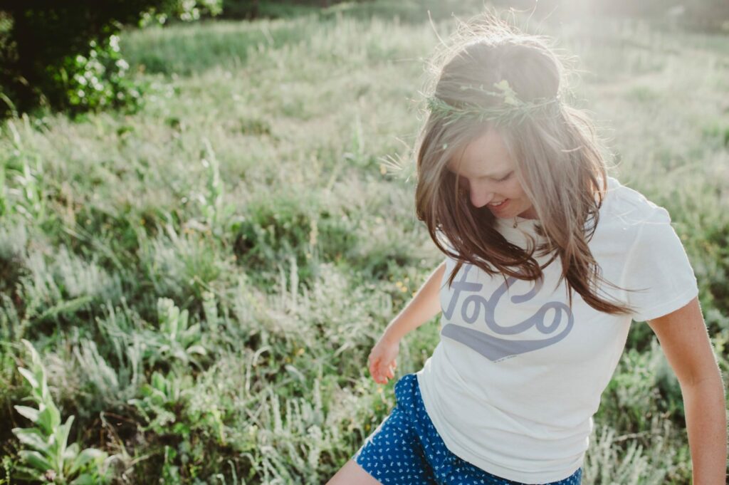 Elizabeth Mayberry Life Style Blogger at  Oak + Oats in Patagonia Shorts. Love the wildflowers and sunset.