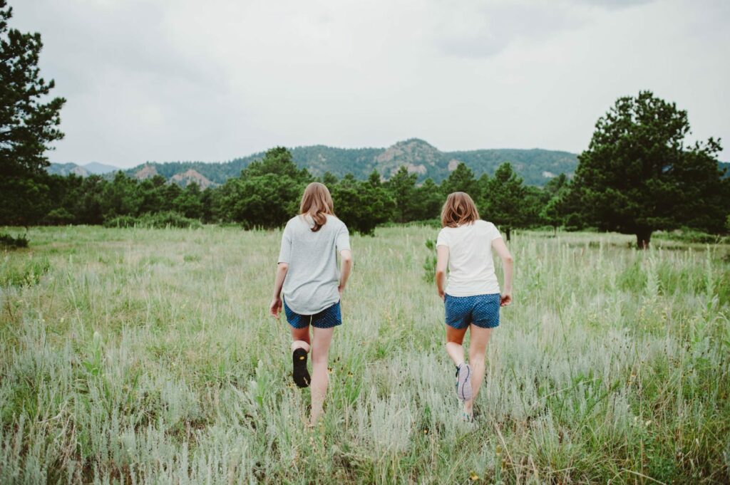 Elizabeth Mayberry Life Style Blogger at  Oak + Oats in Patagonia Shorts. Love the wildflowers and sunset.