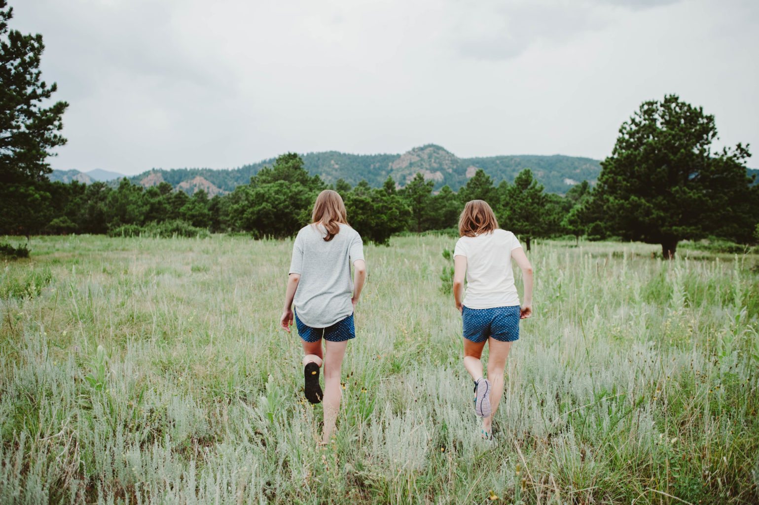 Elizabeth Mayberry Life Style Blogger at  Oak + Oats in Patagonia Shorts. Love the wildflowers and sunset.
