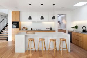Brown Wooden Seat Beside White Wooden Table